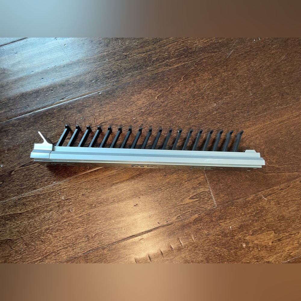 Mountable slide-out tie holder